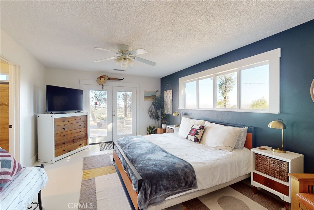 8560 Warren Road Paso Robles, CA 93446 - Photo 25 of 74 a bedroom with a bed and a flat screen tv