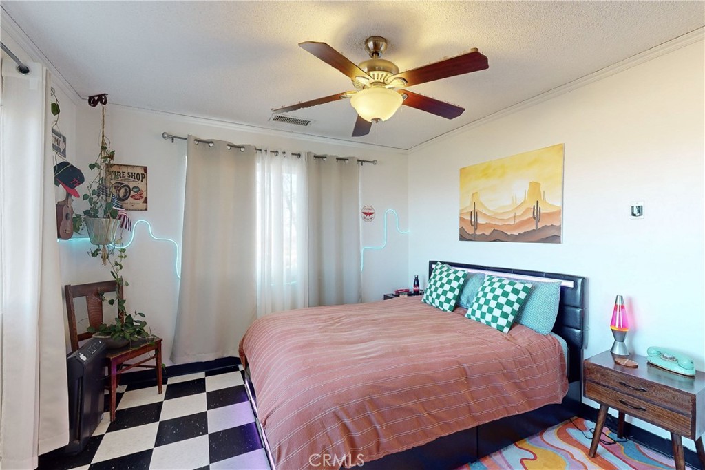 8560 Warren Road Paso Robles, CA 93446 - Photo 31 of 74 a bedroom with a bed and a painting on the wall