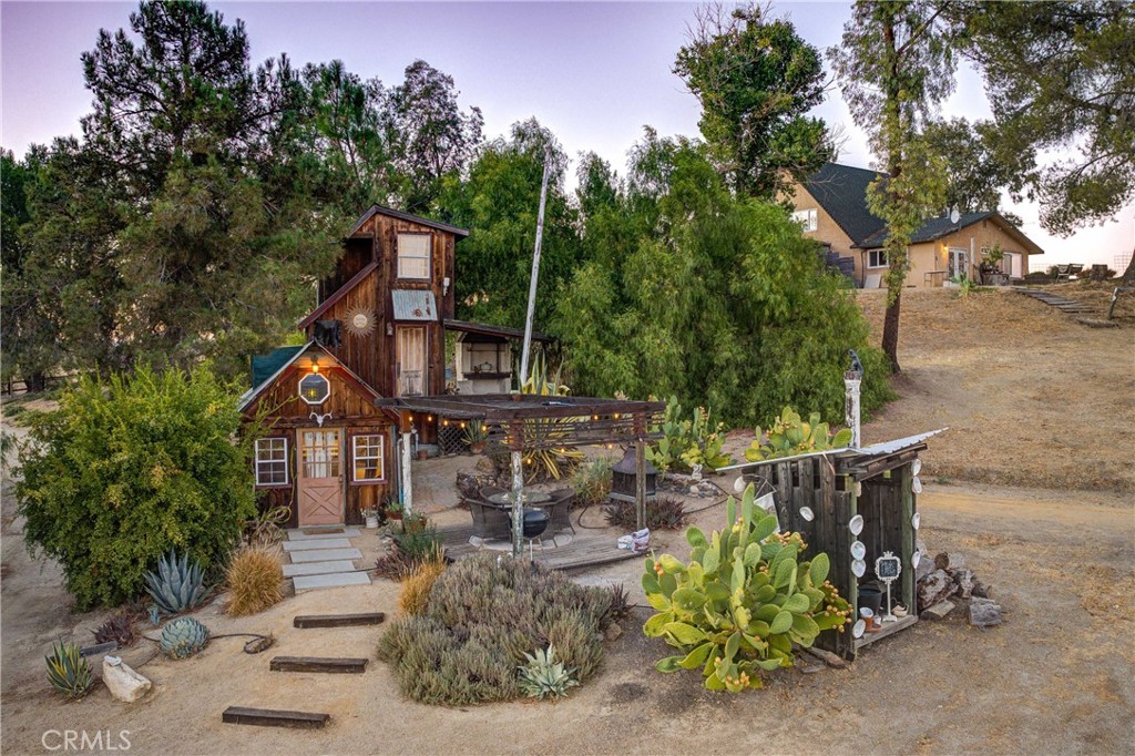 8560 Warren Road Paso Robles, CA 93446 - Photo 34 of 74 a front view of a house with garden