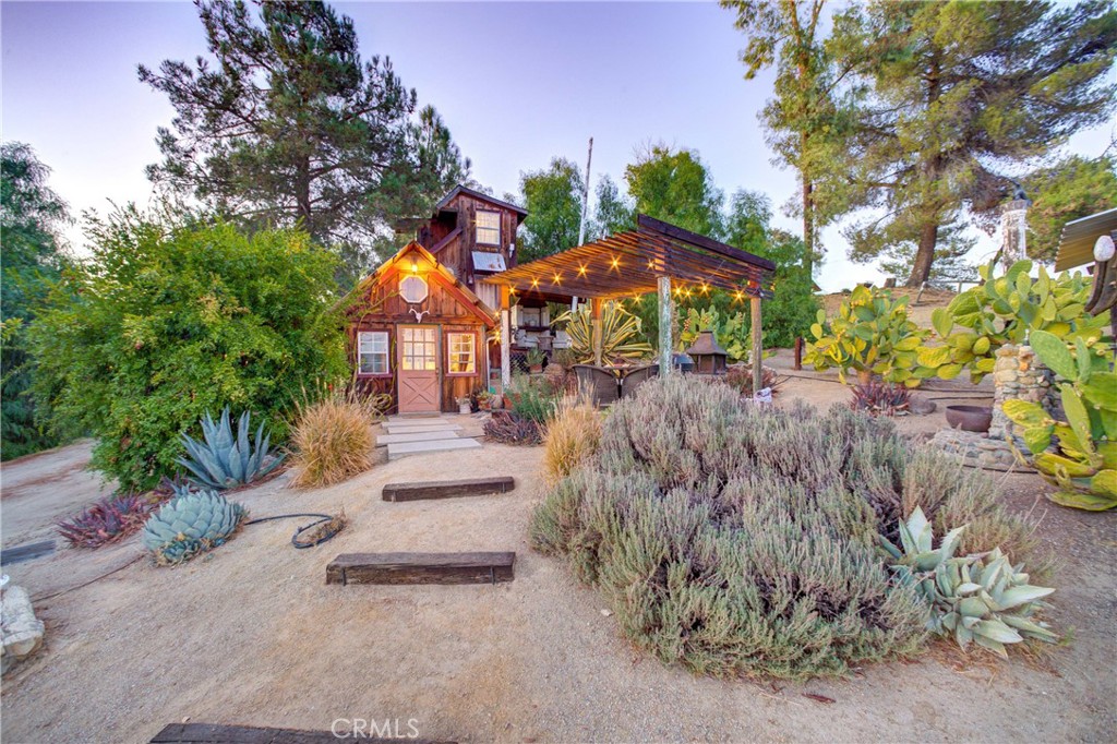 8560 Warren Road Paso Robles, CA 93446 - Photo 35 of 74 a front view of a house with a yard and garage