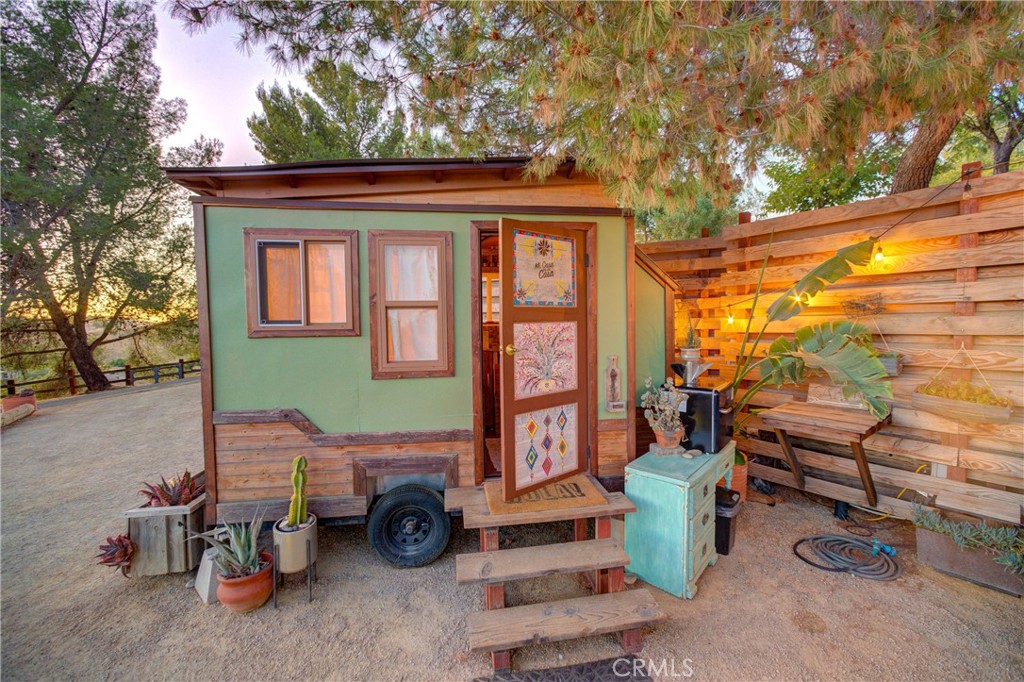8560 Warren Road Paso Robles, CA 93446 - Photo 50 of 74 a backyard of a house with barbeque oven table and chairs