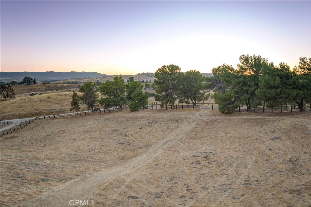 8560 Warren Road Paso Robles, CA 93446 - Photo 65 of 74 a view of a dry yard with trees in the background