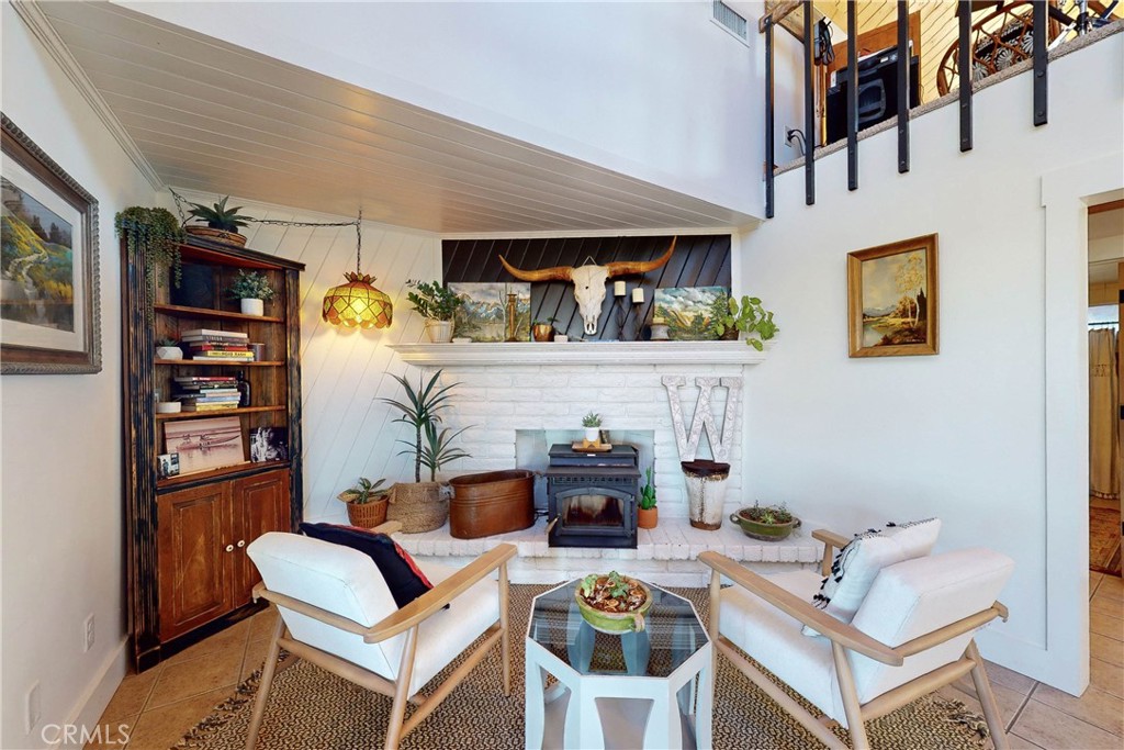 8560 Warren Road Paso Robles, CA 93446 - Photo 8 of 74 a living room with fireplace furniture and a window