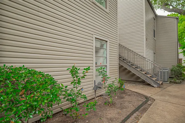 a view of a house with a yard and a garage