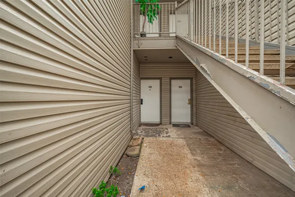 a view of backyard with a large tree