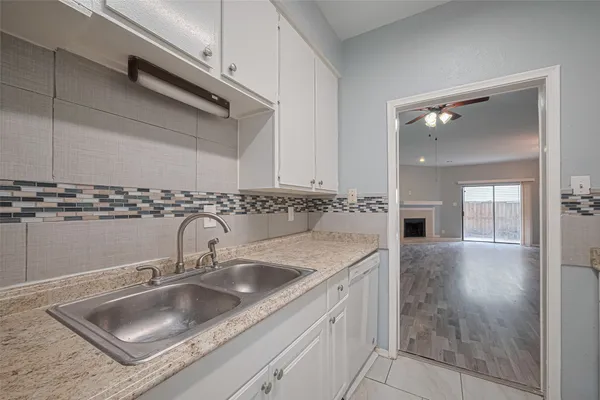 a kitchen with a sink and cabinets