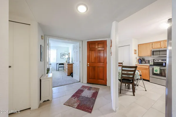 a view of a terrace with couches and potted plants