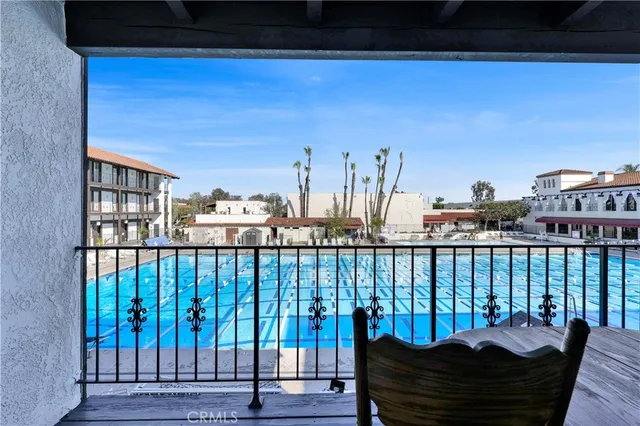 a view of a balcony with furniture