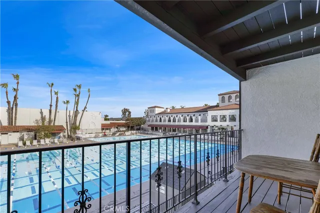 a view of a balcony with furniture