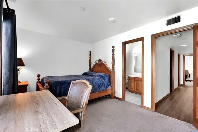 a bedroom with bed and window