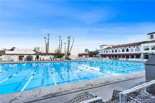 a view of a swimming pool with an outdoor seating