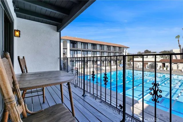 a view of a balcony with furniture