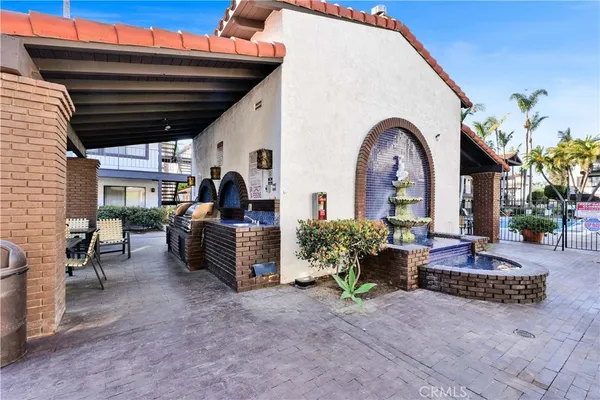 a view of a swimming pool with outdoor seating