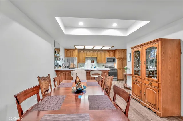 a living room with lots of furniture and a large window