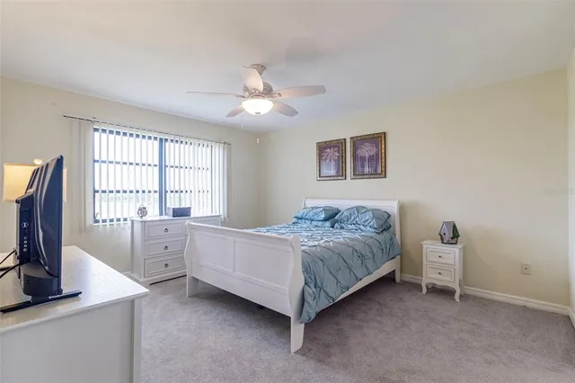 a bed room with a bed and a flat screen tv