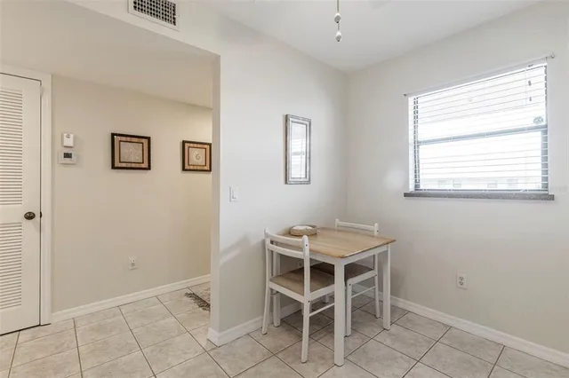 a view of a room with furniture and window