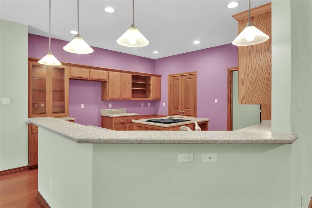 2255 Davy Lane Denison, TX 75020 - Photo 16 of 37 a view of a kitchen with a sink and a chandelier