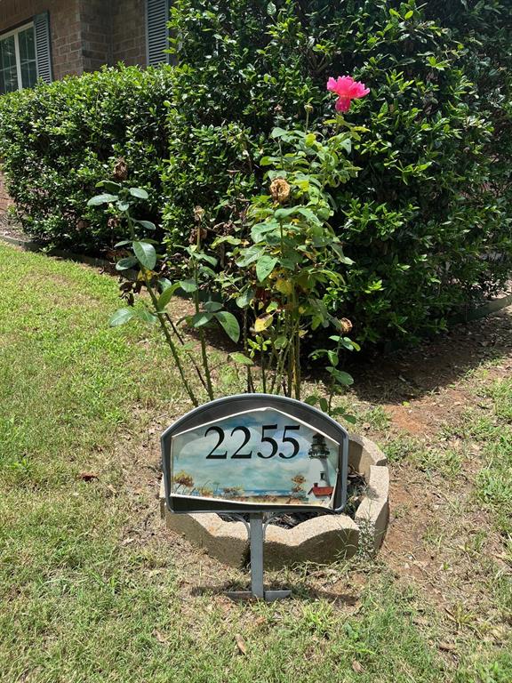 2255 Davy Lane Denison, TX 75020 - Photo 2 of 37 a view of a bench in a backyard of a house
