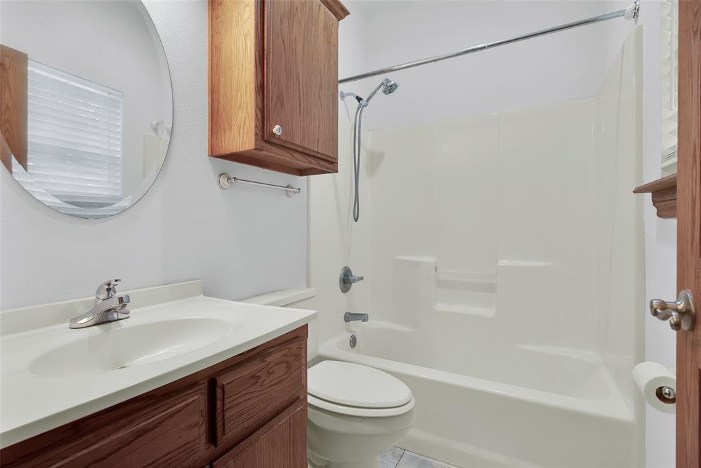 2255 Davy Lane Denison, TX 75020 - Photo 29 of 37 a bathroom with a sink a toilet and a bathtub