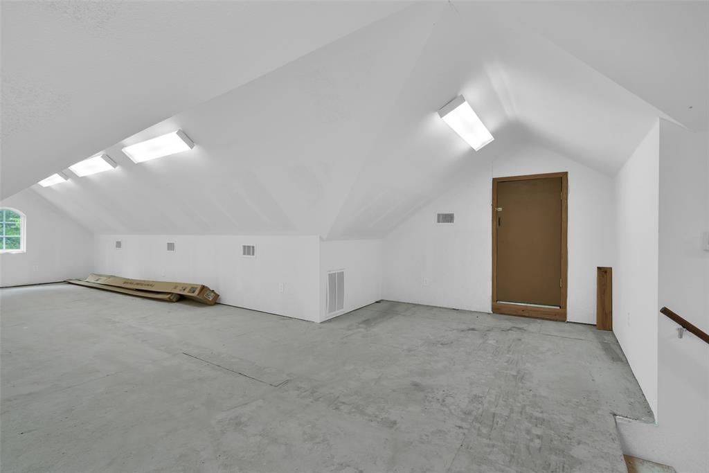 2255 Davy Lane Denison, TX 75020 - Photo 31 of 37 an empty room with a white wall and ceiling fan