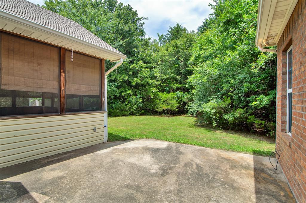 2255 Davy Lane Denison, TX 75020 - Photo 37 of 37 a view of a backyard with large trees