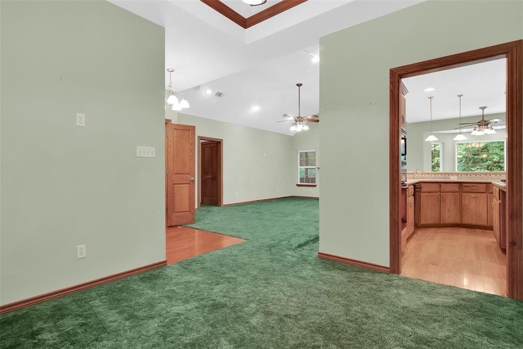 2255 Davy Lane Denison, TX 75020 - Photo 7 of 37 an empty room with a window and a kitchen