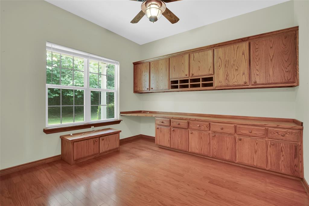 2255 Davy Lane Denison, TX 75020 - Photo 8 of 37 a living room with stainless steel appliances granite countertop a stove a sink and a microwave