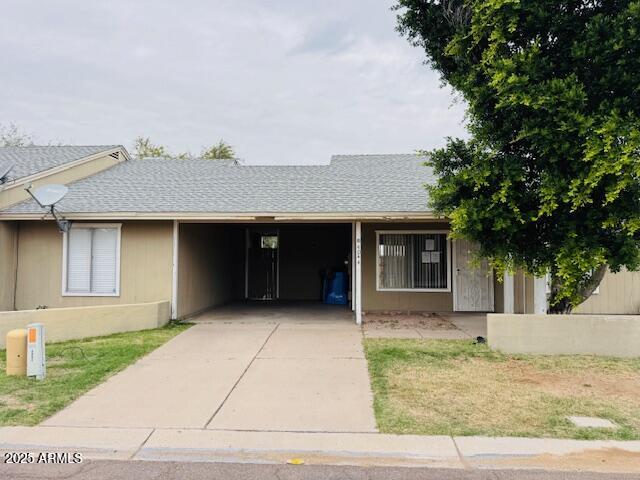 4044 East Carson Road Phoenix, AZ 85042 - Photo 1 of 22 a front view of a house with garden