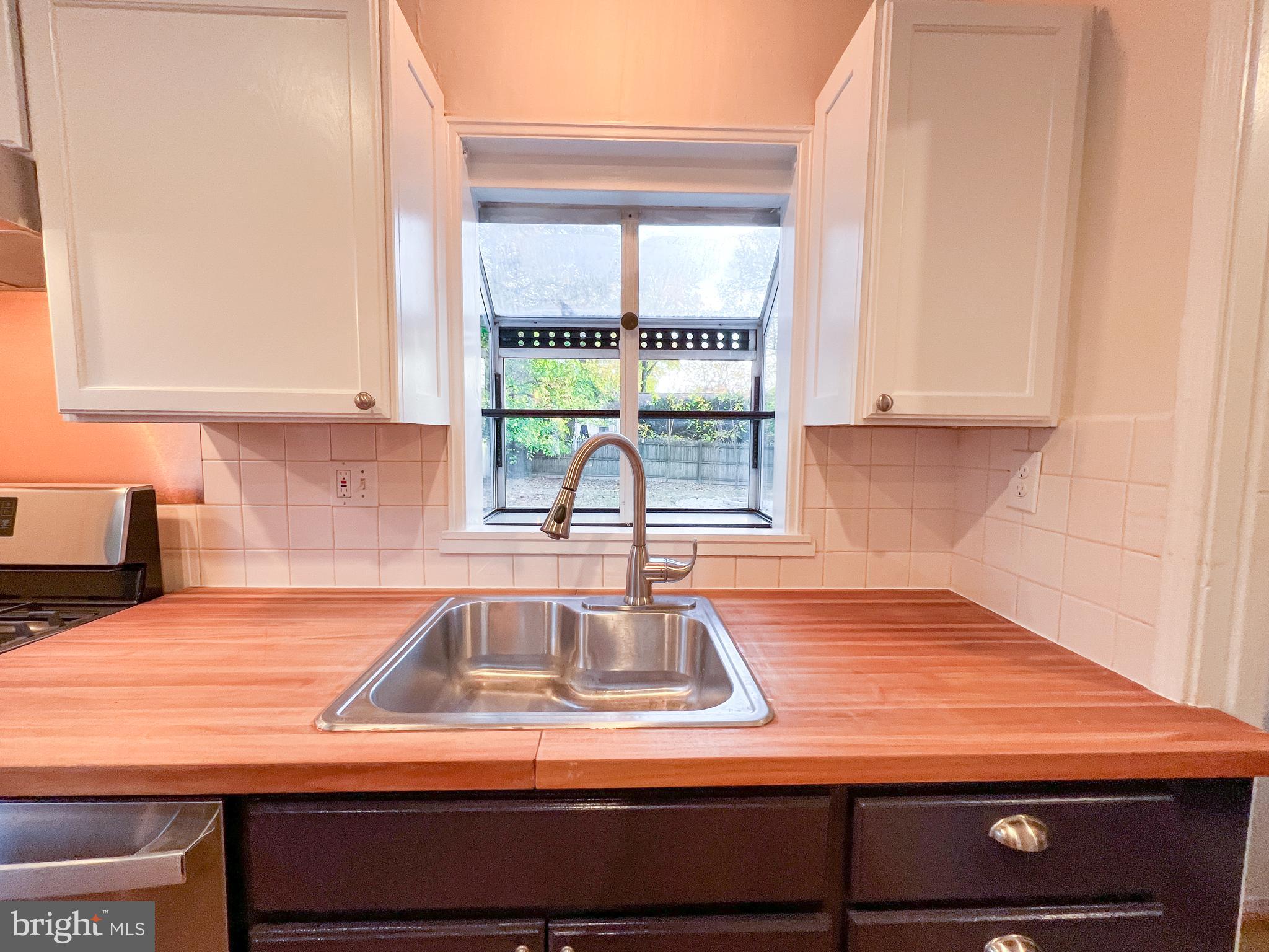 3000 Edgewood Road Kensington, MD 20895 - Photo 12 of 28 a kitchen with a sink and a window