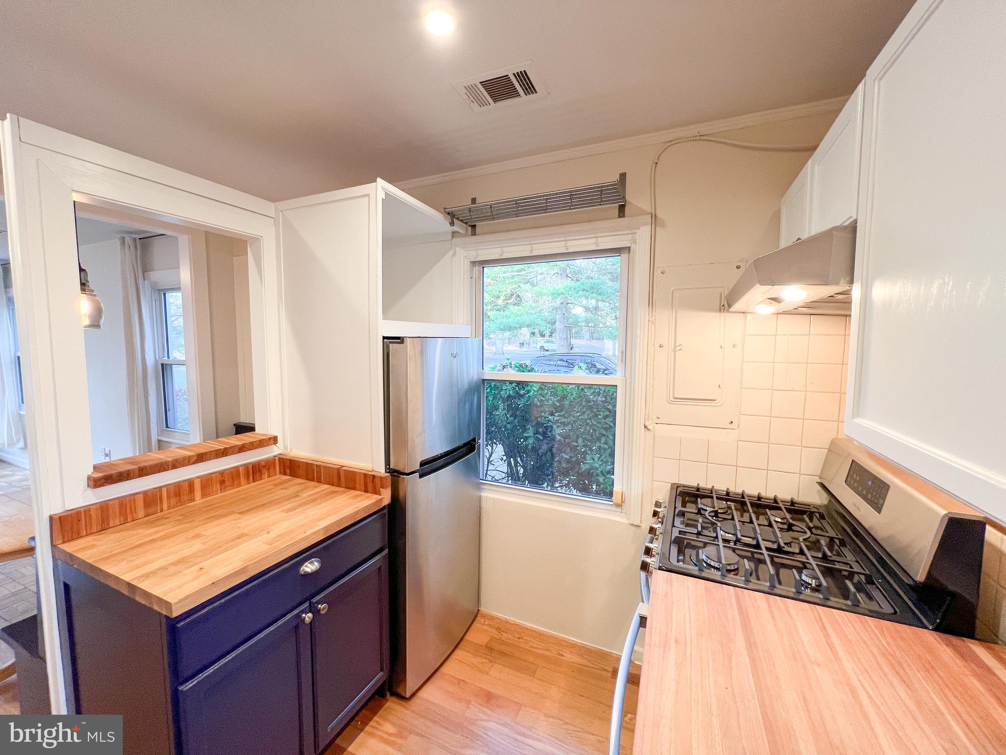 3000 Edgewood Road Kensington, MD 20895 - Photo 14 of 28 a bathroom with a sink a large mirror and a shower