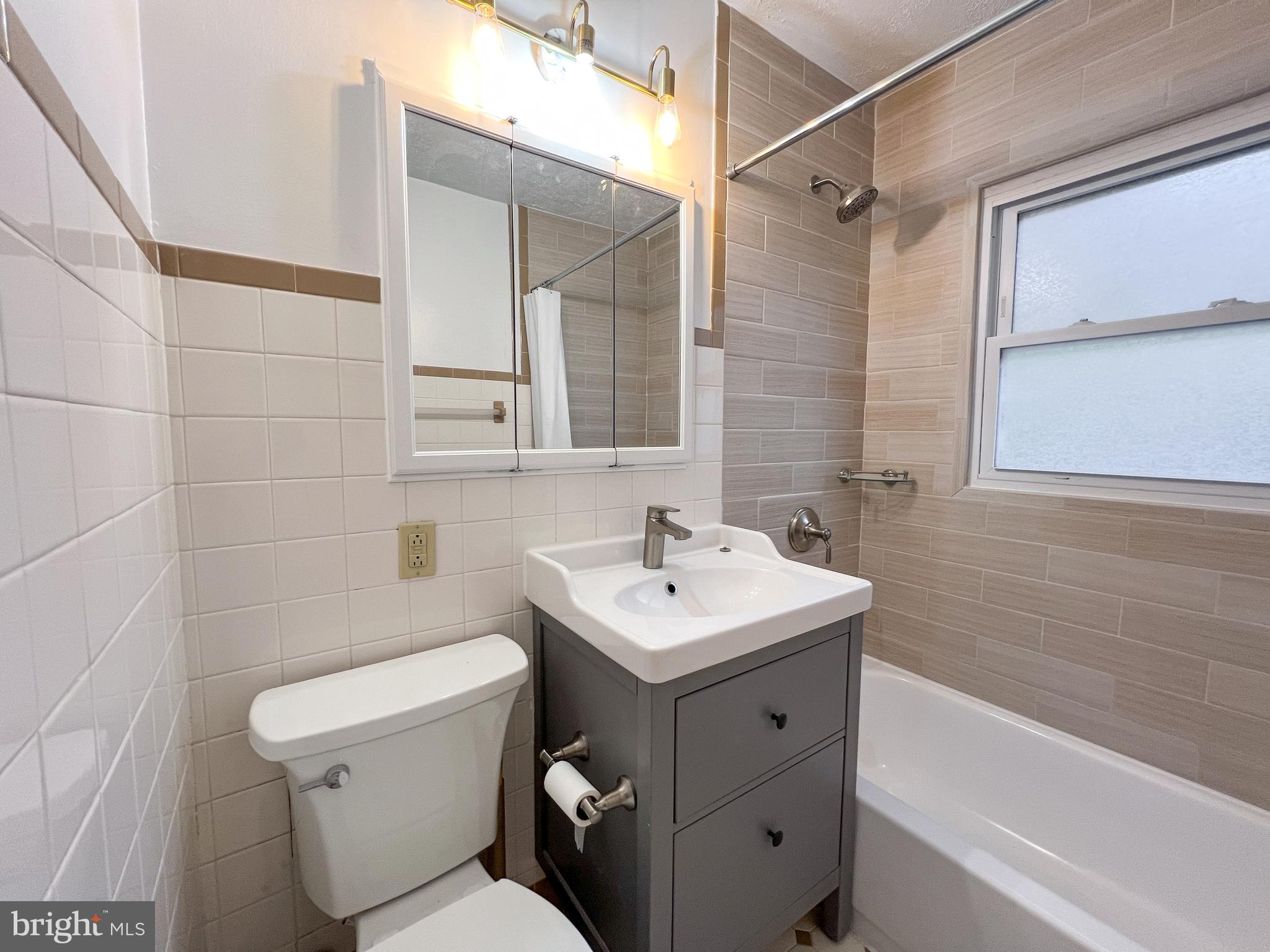 3000 Edgewood Road Kensington, MD 20895 - Photo 16 of 28 a bathroom with a sink toilet and shower