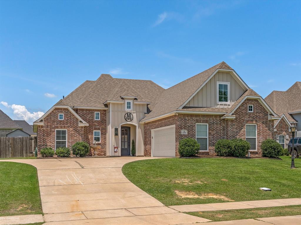 690 Lessie Drive Stonewall, LA 71078 - Photo 2 of 29 Brick and siding exterior with a gabled roofline