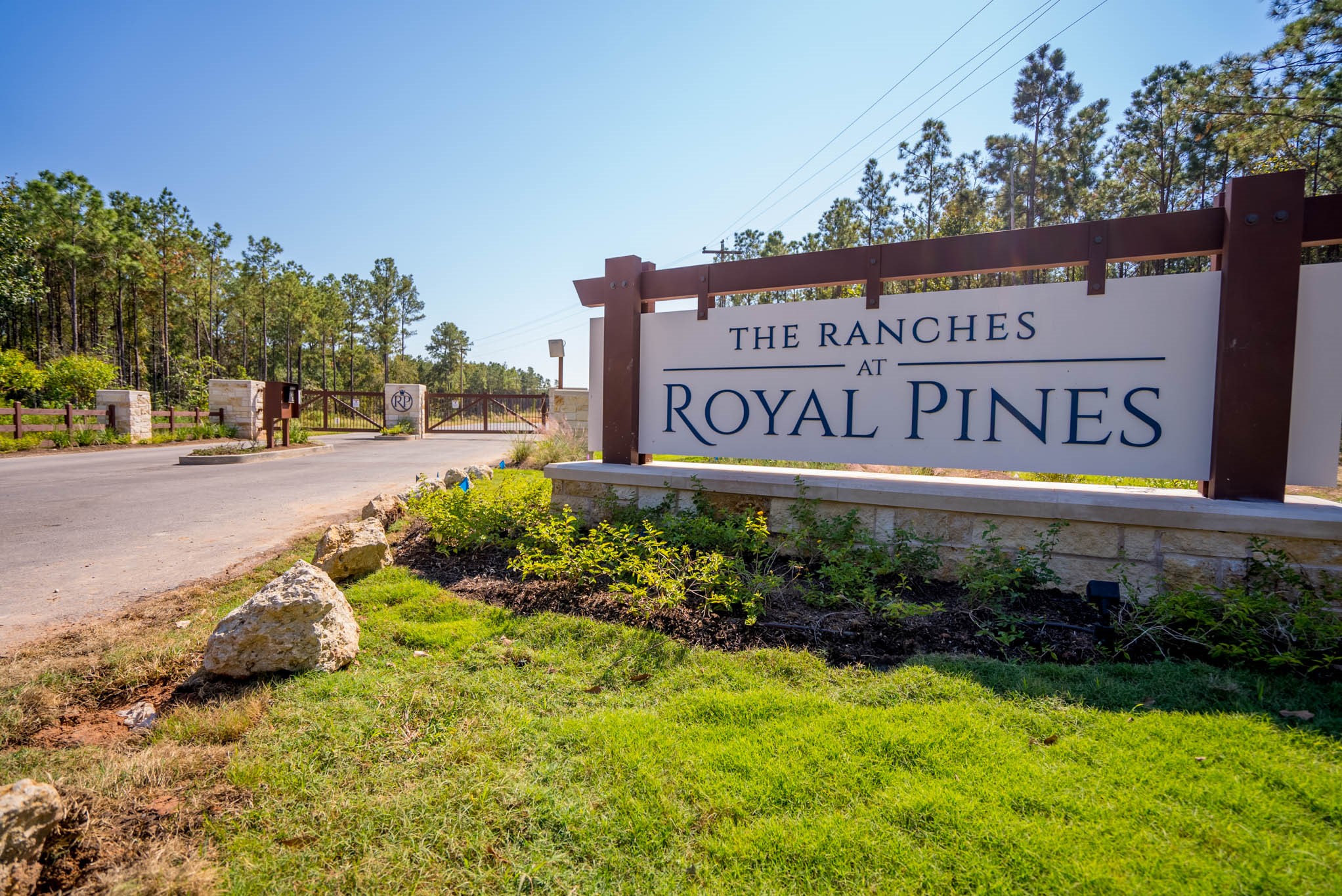 0 Queen Anne Huntsville, TX 77340 - Photo 1 of 12 a view of sign board with buildings and trees