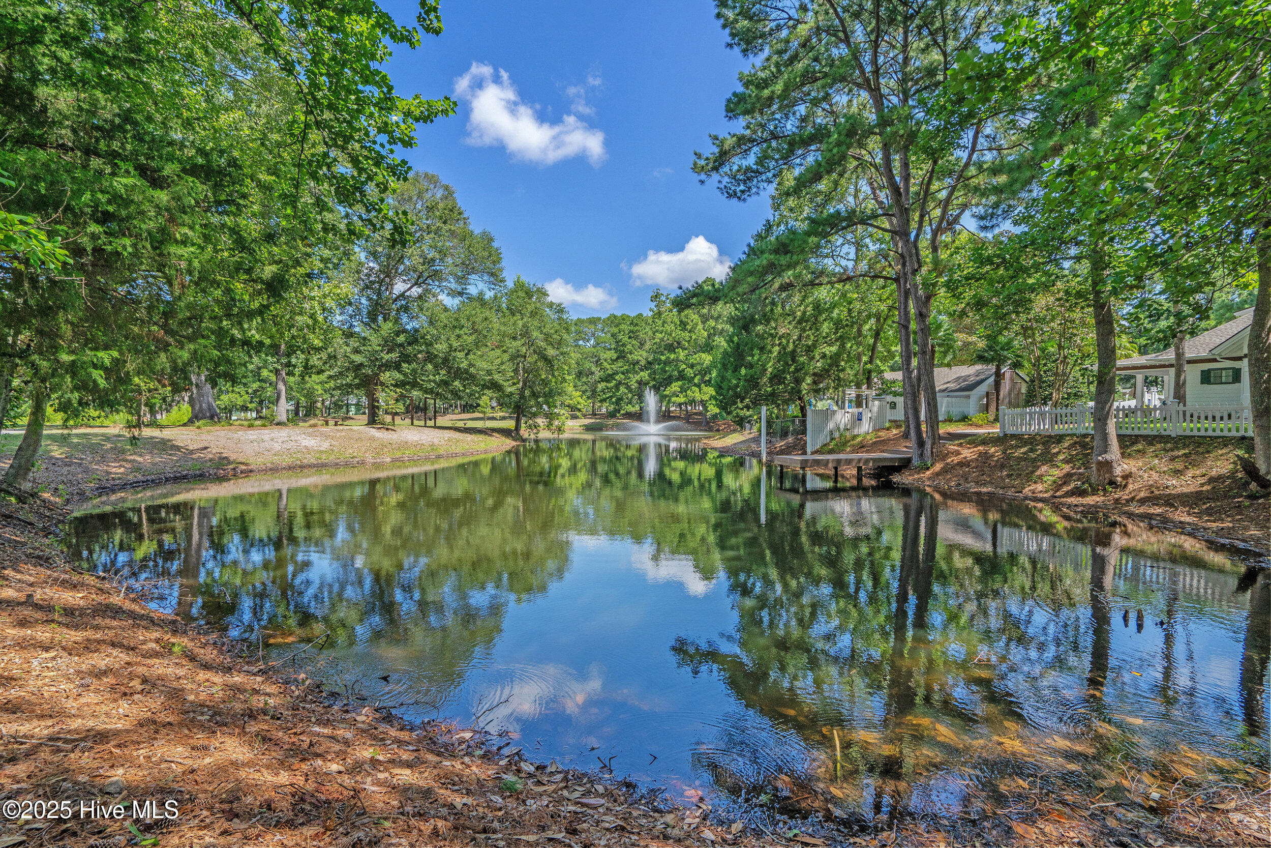 9266 West Lake Road Calabash, NC 28467 - Photo 14 of 15 Picture your dream traditional home on this prime homesite in Devaun Park, a truly special place. Stately oak trees, charming picket fences, winding sidewalks, inviting parks, friendly neighbors, and the timeless appeal of front porch living all combine to make this location simply irresistible.