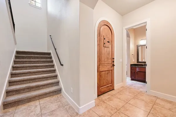 a kitchen with stainless steel appliances granite countertop a refrigerator and a stove