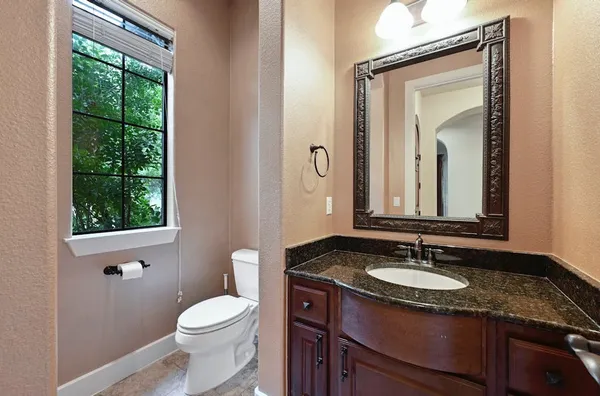 a kitchen with stainless steel appliances granite countertop a stove and a sink