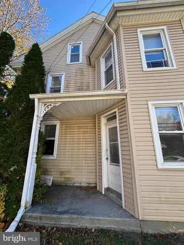 a front view of a house with stairway