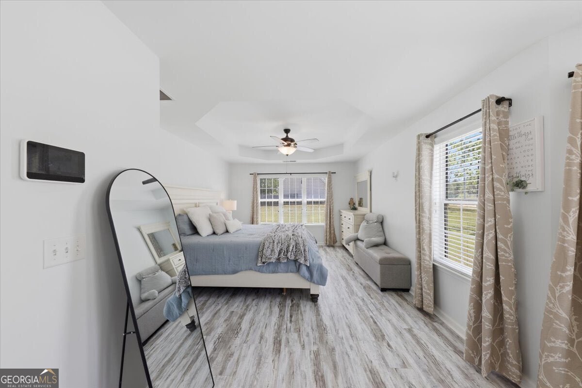 1201 Pendley Point Hampton, GA 30228 - Photo 12 of 23 a living room with furniture and a window