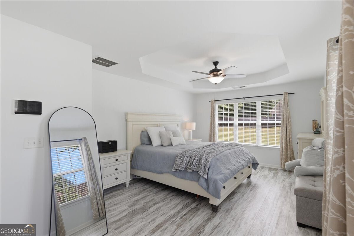 1201 Pendley Point Hampton, GA 30228 - Photo 14 of 23 a living room with furniture and a large window