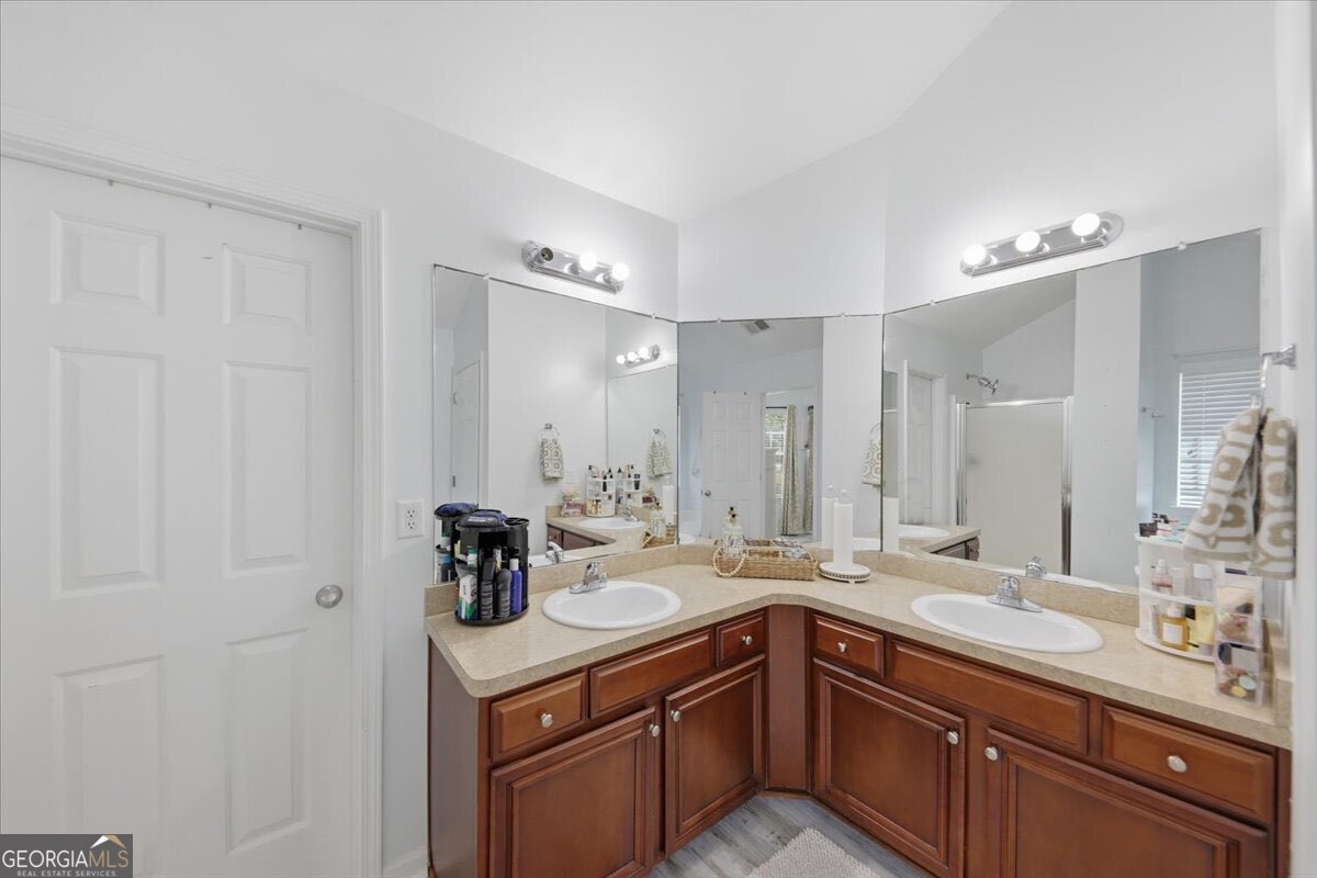 1201 Pendley Point Hampton, GA 30228 - Photo 15 of 23 a bathroom with a sink double vanity and a mirror