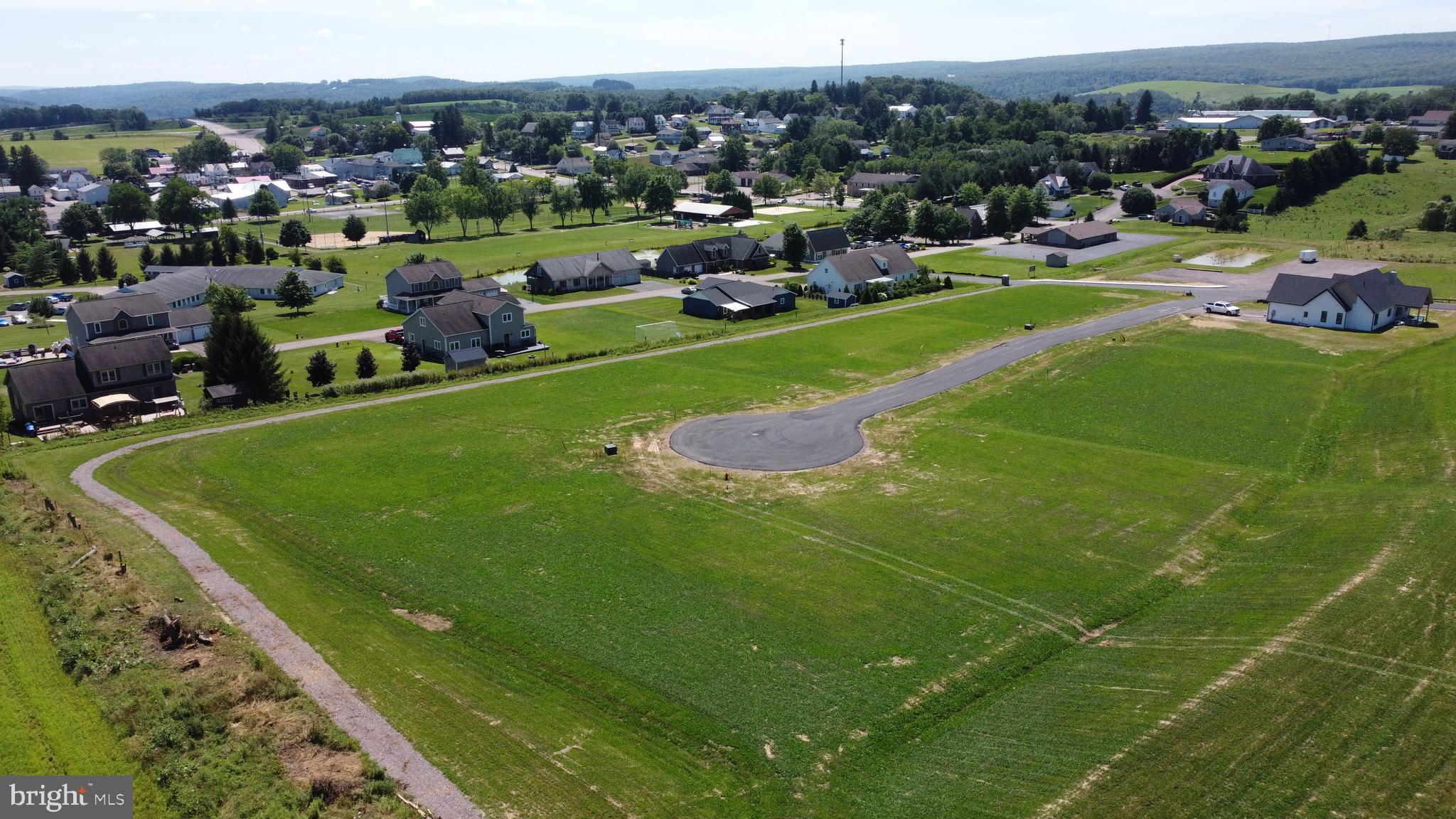 57 Walnut Ridge Grantsville, MD 21536 - Photo 7 of 8 a view of a stadium that has a big yard