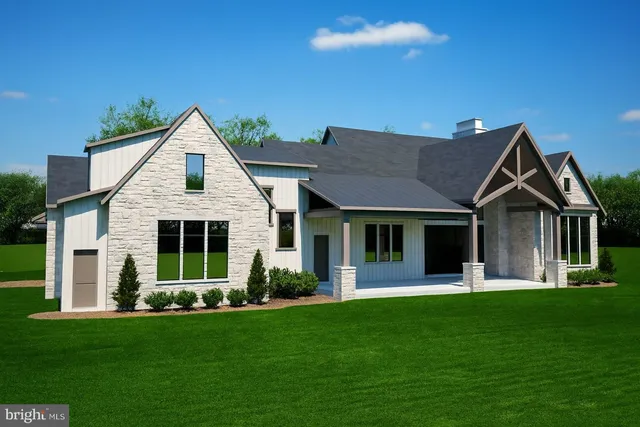 a front view of a house with a yard and porch