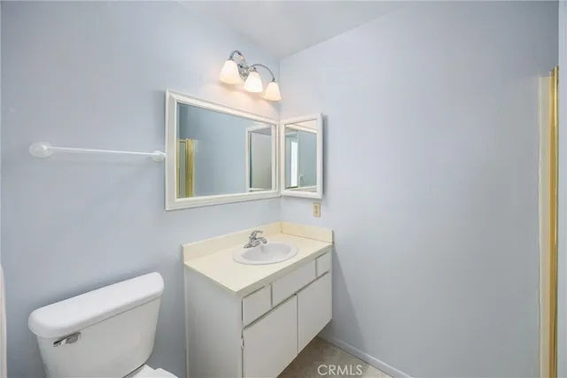 a bathroom with a sink mirror and a shower
