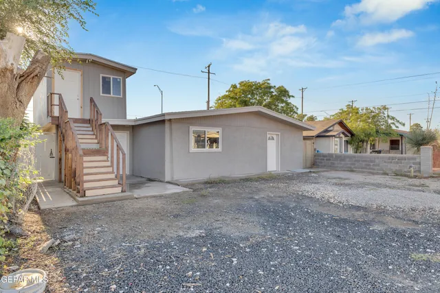 a view of a house with a yard and garage