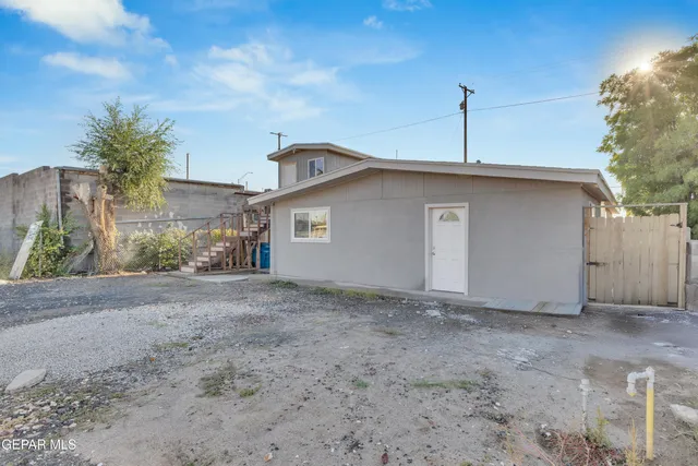 a view of a house with a yard and garage