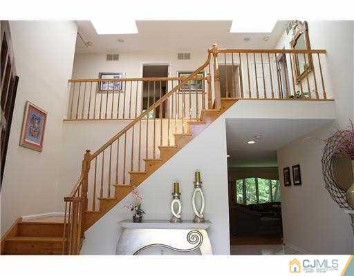 80 Ellmyer Road Edison, NJ 08820 - Photo 2 of 25 a view of entryway and hall with wooden floor