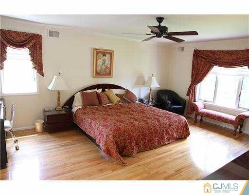 80 Ellmyer Road Edison, NJ 08820 - Photo 11 of 25 a bedroom with a bed window and wall painting
