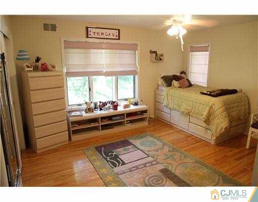 80 Ellmyer Road Edison, NJ 08820 - Photo 14 of 25 a bedroom with a bed and a window