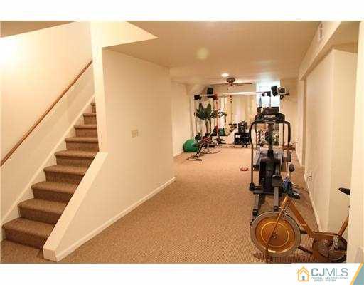 80 Ellmyer Road Edison, NJ 08820 - Photo 17 of 25 a view of a room with gym equipment