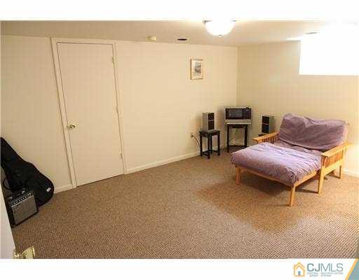 80 Ellmyer Road Edison, NJ 08820 - Photo 20 of 25 a balcony with chairs and a table